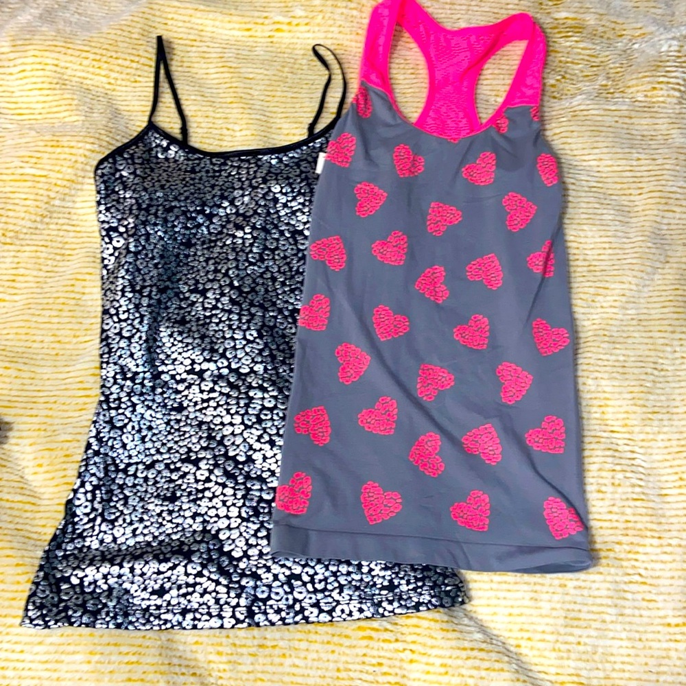 Both tank tops black is size S, pink is size XS
